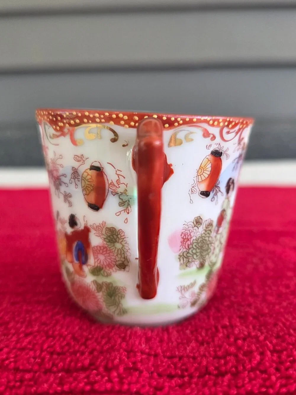 Japanese hand painted porcelain demitasse cup and saucer Geisha garden gilt trim
